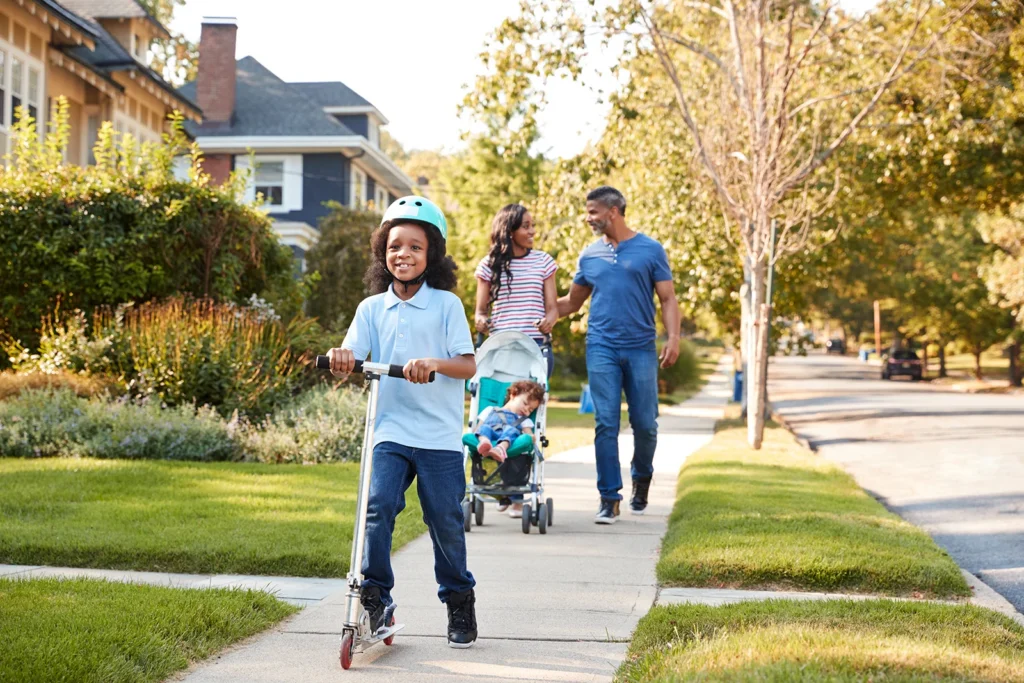Best Jacksonville neighborhoods for families 2026: family walking together in a residential neighborhood